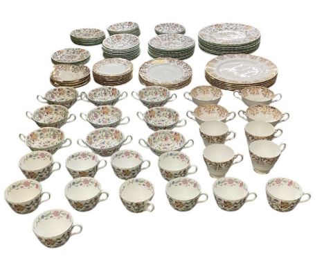 MINTON; a part tea and dinner service decorated in the 'Haddon Hall' pattern, including ten teacups, eight soup cups, eight s