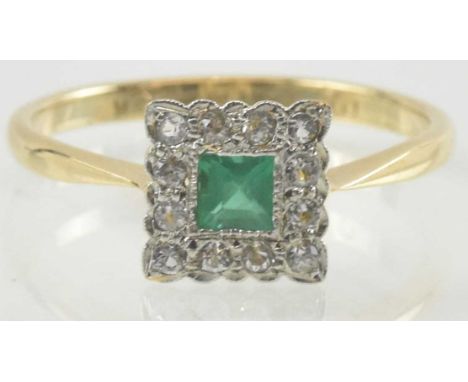 A 9ct gold Art Deco style ring, with central cushion cut emerald within a square border of tiny diamonds set in a platinum mo