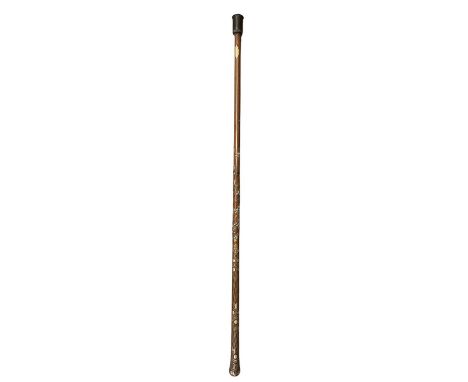 A late 19th/early 20th century white metal inlaid lady's walking cane, overset with white metal, copper and brass wire, lengt