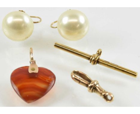 A pair of 9ct yellow gold mounted simulated pearl set earrings, a yellow metal mounted amber effect heart shaped pendant, 1.8