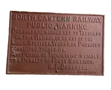NORTH EASTERN RAIL; a vintage red painted cast iron North Eastern Railway Public Warning sign, 59.5 x 90.5cm.