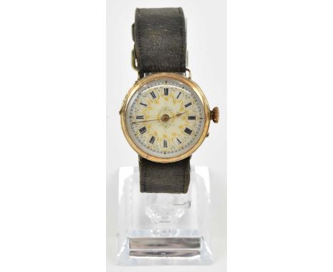 A late 19th century Continental 14ct yellow gold lady's wristwatch head, the white enamel and gilt decorated dial set with Ro