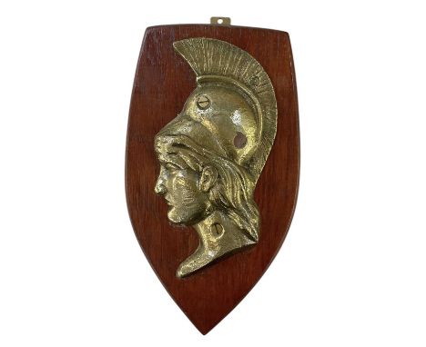 An early 20th century oak mounted brass boat badge, 'HMS Majestic', badge measures 23 x 11cm, overall size on plaque 31 x 17c