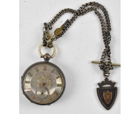 A hallmarked silver cased open face key wind pocket watch, with gold heightened raised Roman numerals on a silvered and flora