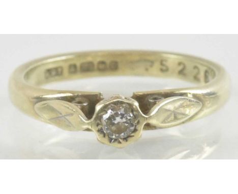 A 9ct yellow gold diamond set solitaire ring, the central stone approx 0.1ct, size K, approx 2.6g.