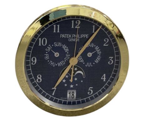 A decorative Patek Philippe style dealer's wall clock, the blue dial set with subsidiary seconds, Arabic numerals, day and mo