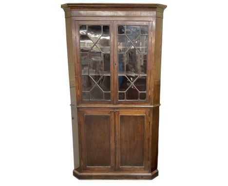 A large late 19th century flat fronted freestanding mahogany corner cupboard, width 115cm, height 205cm.