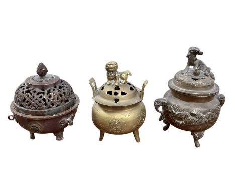 A small Japanese brass lidded censer, the top surmounted with Dog of Fo decoration, height 12cm, a further bronzed metal lidd