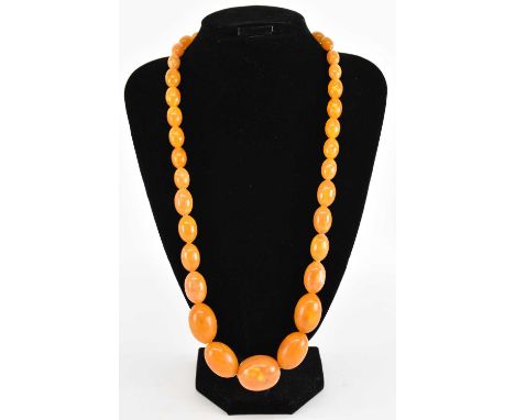 A butterscotch amber effect bead necklace, length approx 70cm.