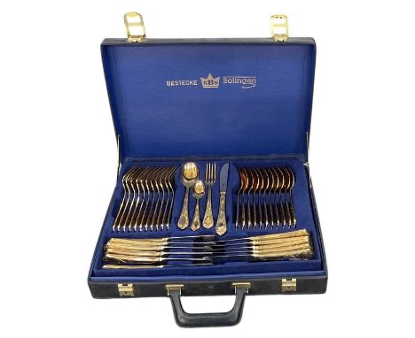 BESTECKE SOLINGEN; a twelve setting 24ct gold plated canteen of cutlery, in leather travelling case.