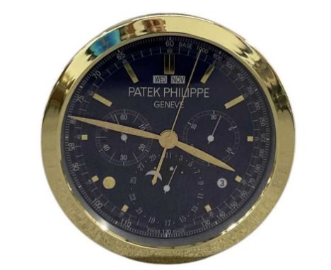 A decorative Patek Philippe style dealer's wall clock, the blue dial set with subsidiary seconds, hour markers, day and date 