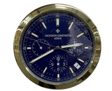 A decorative Vacheron Constantin style dealer's wall clock, the blue dial set with subsidiary seconds and date aperture, and 