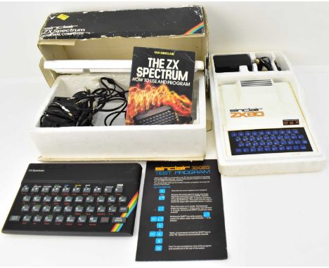 A Sinclair ZX80, with cables, power pack and test programme pamphlet, in polystyrene case (no outer box), and a Sinclair ZX S