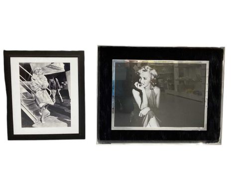 A large modern chrome and velvet framed printed photograph of Marilyn Monroe, 49 x 69cm, framed and glazed, and a further pri