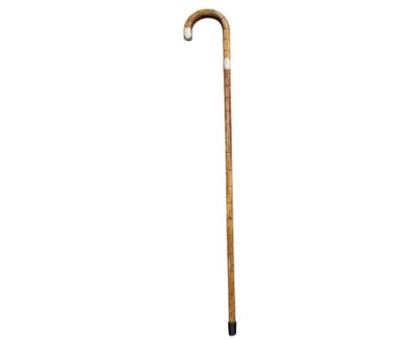 An Edward VII hallmarked silver mounted bamboo walking cane, London 1903, length 91cm.