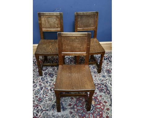 DEREK 'LIZARDMAN' SLATER; three oak chairs with panelled backs, each inscribed with names and dates 'G.E. Middleton 1952-56, 