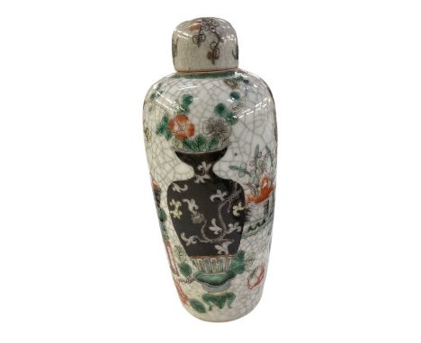 A Chinese crackle glaze lidded jar, decorated with vases and foliage, with four character mark to base, height 24cm.