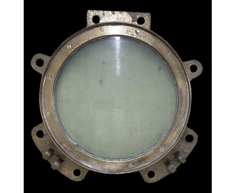 An early 20th century heavy brass ship's porthole window, overall diameter approx 54cm, window diameter approx 35.5cm.