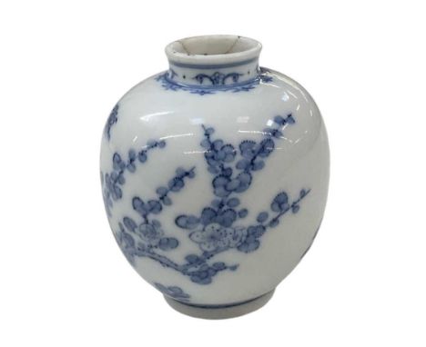 A small Chinese blue and white ginger jar, decorated with foliage, with six character Yongzheng mark to base, height 8.5cm.