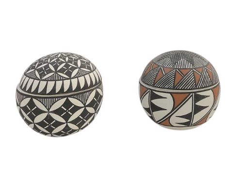 K ARAGON; a Native American Acoma pottery lidded pot and matching black and white lidded pot, both height 8cm (2).