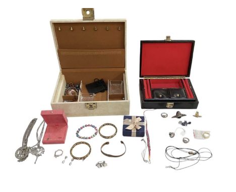 A small quantity of costume jewellery contained in two jewellery boxes, including bangles, rings, necklaces, brooches, etc.