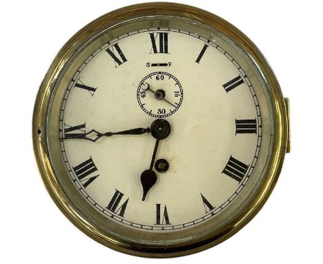 An early 20th century brass cased ship's wall clock, the white painted dial set with Roman numerals and subsidiary seconds, d