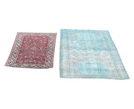 A modern machine made Persian style red ground floral decorated carpet with cream border, 206 x 133cm, and a modern machine m