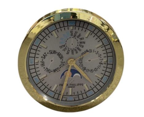 A decorative Patek Philippe style dealer's wall clock, the grey dial set with subsidiary seconds, day, month and date, the di