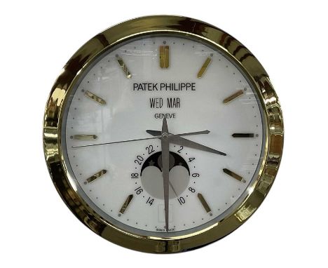 A decorative Patek Philippe style dealer's wall clock, the white dial set with subsidiary seconds and gold hour markers, the 