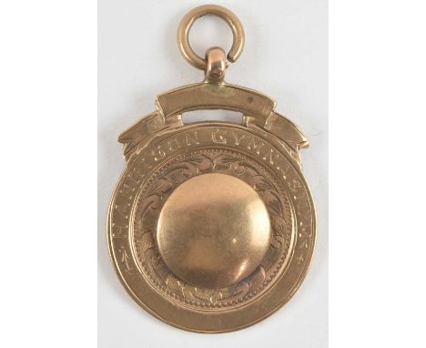 A 9ct rose gold boxing winner's medal, won by T Standen 1926, diameter 2.8cm, approx 10.7g.