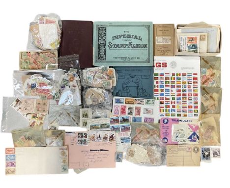 A collection of all world stamps in bags and envelopes, with the Scott Imperial Stamp Album.