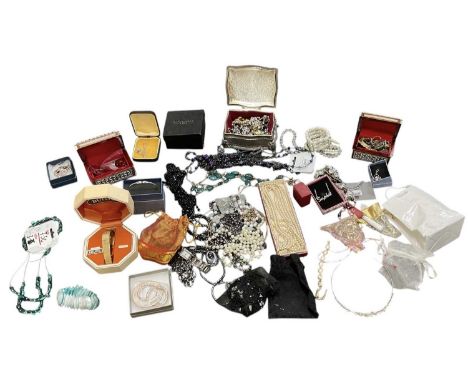 A large quantity of costume jewellery including a silver plated trinket box containing beads, bracelets, bangles, watches, ne