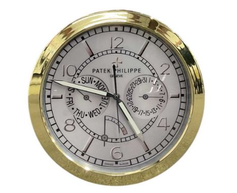 A decorative Patek Philippe style dealer's wall clock, the grey dial set with Arabic numerals and subsidiary seconds, day and