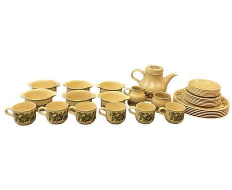 A 1970s pottery tea service including teapot, six teacups, milk jug, sugar bowl, six saucers, six side plates, six plates and