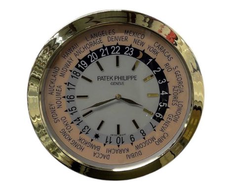 A decorative Patek Philippe World Time style dealer's wall clock, diameter 40cm.Condition Report: Please note, these are all 