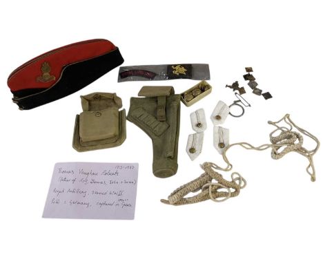 A WWII Royal Artillery gun pouch, canvas pouch, cap and arm badges, also a small collection of buttons and cap badges belongi