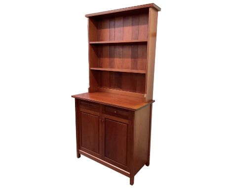 PEARL DOT; a 1970s Brazilian mahogany bookcase, with boarded plate rack back above two drawers above pair of cupboard doors, 