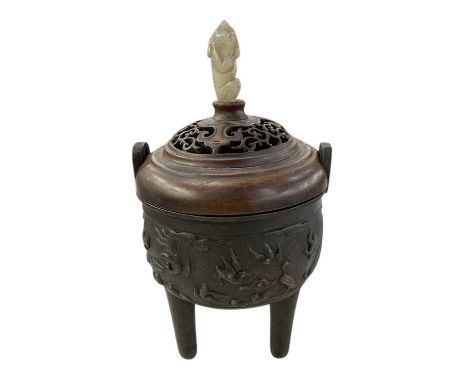 A Japanese Meiji period bronze twin handled censer, with carved hardwood lid surmounted with small jade carving of a monkey, 