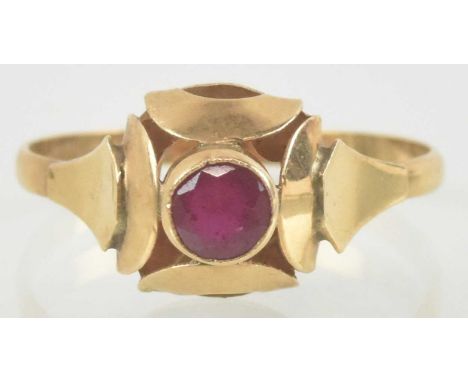 An Art Deco ruby ring, with stylised head and central bezel set ruby on a 14ct gold shank, size Q, approx 2g.