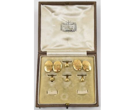 A cased pair of 18ct yellow gold cufflinks and four 18ct yellow gold dress studs, combined approx 16.1g.