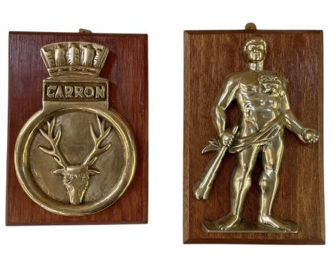 An early 20th century oak mounted Royal Navy boat badge, 'HMS Carron', 21 x 14cm, overall size on plaque 24 x 17cm, and a fur