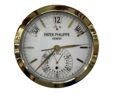 A decorative Patek Philippe style dealer's wall clock, the white dial set with subsidiary seconds, hour markers, date and dat