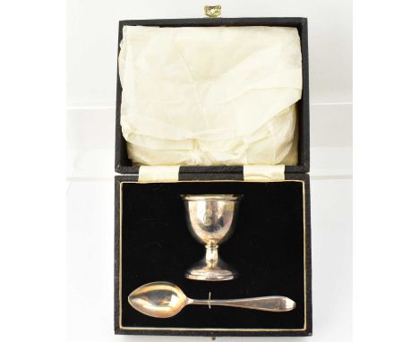 A L DENNISON; a George V hallmarked silver christening egg cup and spoon, with initial 'C' to front, Birmingham 1913, approx 