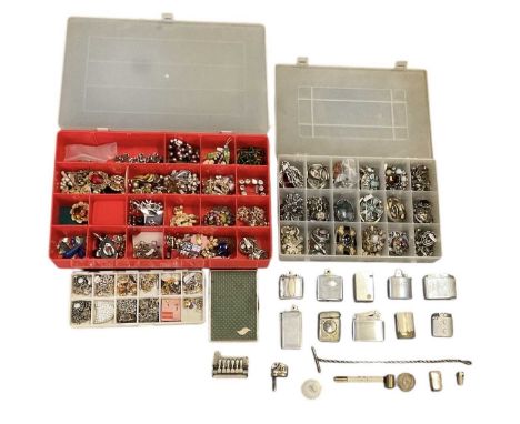 A large quantity of assorted costume jewellery contained in four plastic boxes, including brooches, rings, necklaces, earring