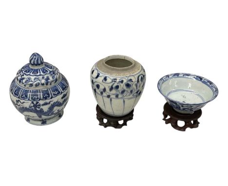 Two pieces of blue and white Tek Sing Cargo porcelain, both on carved hardwood bases, height of ginger jar 14cm, diameter of 