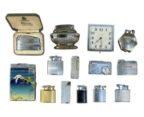 A collection of lighters and table lighters including a boxed Ronson lighter, further Ronson lighters, Beck lighter with cloc