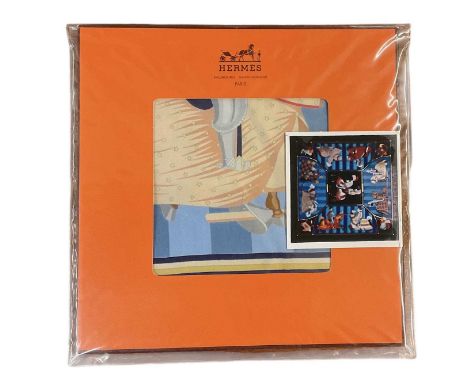 IN THE STYLE OF HERMÈS; a vintage silk scarf, 'Chocs en Plumes', 85 x 85cm, in original box and packaging.