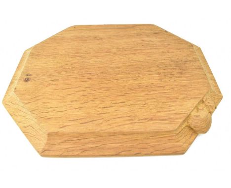 ROBERT 'MOUSEMAN' THOMPSON; a carved oak breadboard, with mouse to top edge, length 30.5cm, width 25cm.   Provenance: Purchas