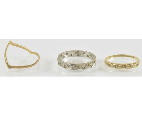 Three 9ct gold rings comprising a wishbone ring, size Q, a small half eternity ring with tiny diamond chips, size P, and a wh