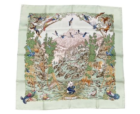 IN THE STYLE OF HERMÈS; a vintage silk scarf, 'Sichlian', decorated with pandas, leopards, birds and other wild animals among